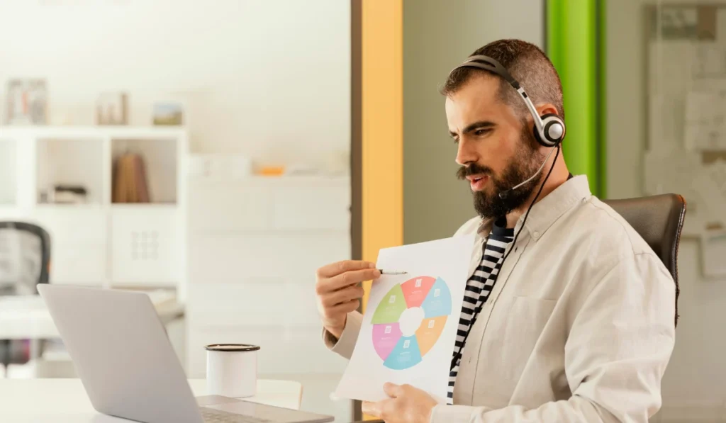 Man in Headphones Reviewing Paper