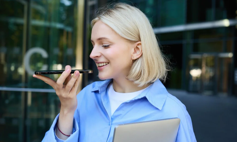 A woman with short blonde hair is smiling