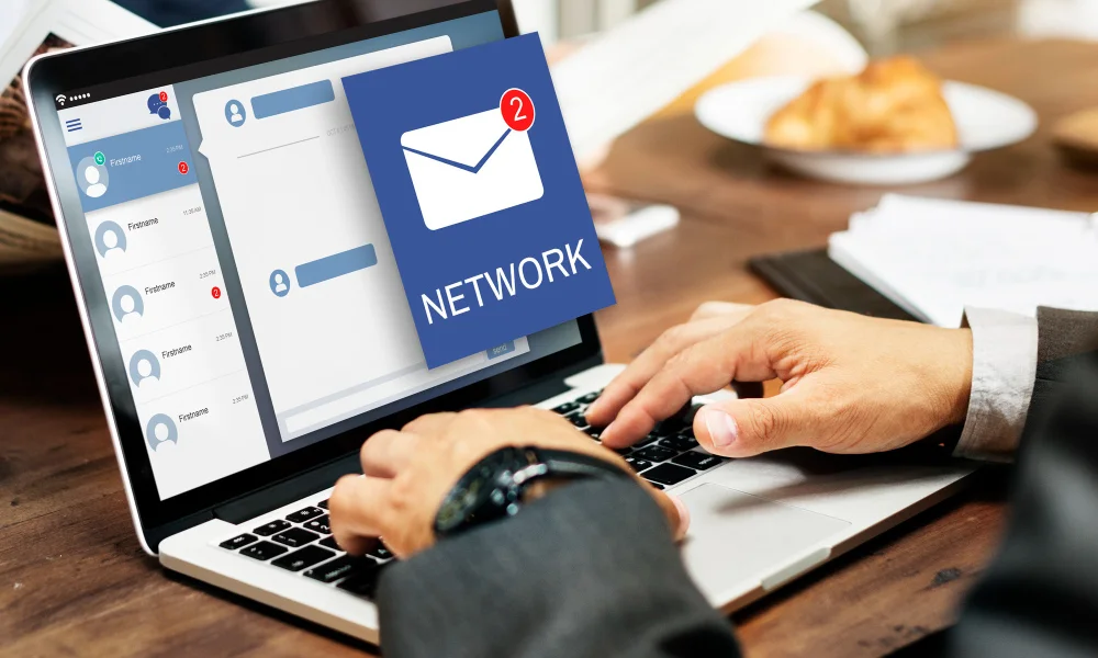 person types on a laptop