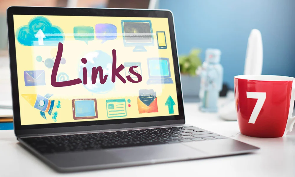 A laptop displays a colorful screen with the word "Links"