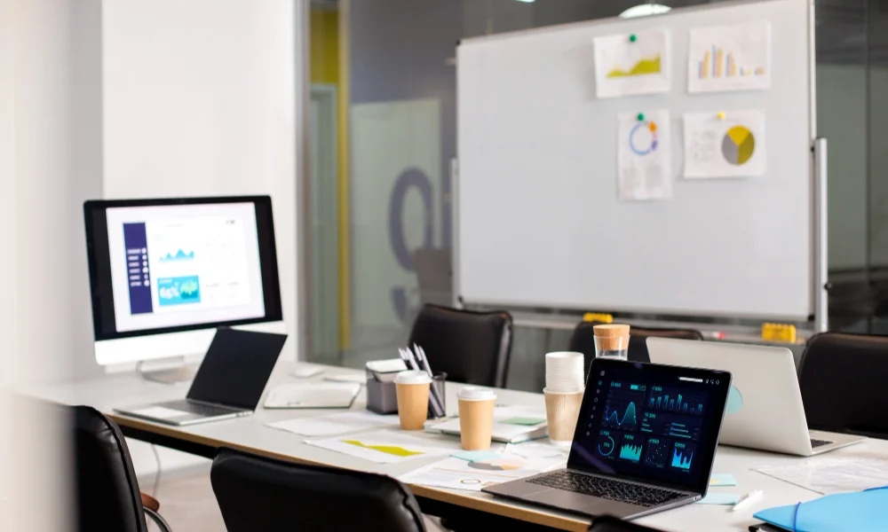 Modern conference room with a table covered in laptops-seo for beginners